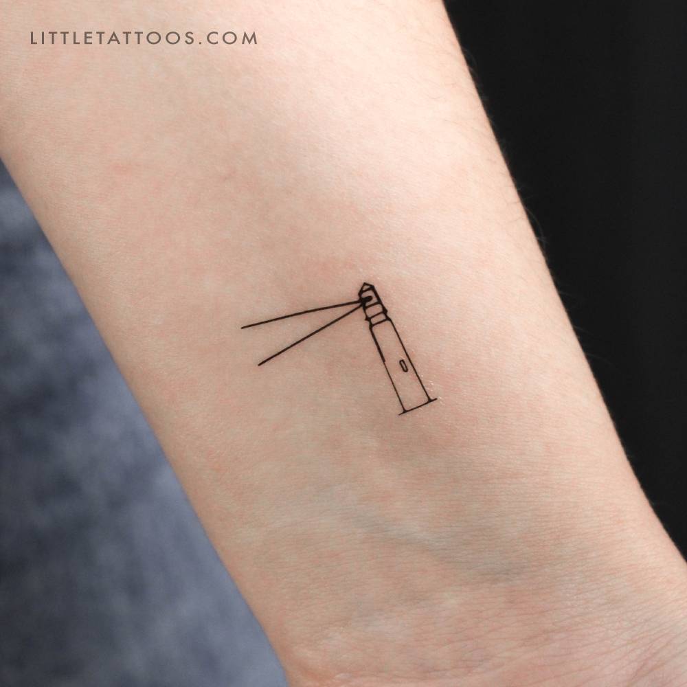 Lighthouse temporary tattoo in minimalistic style located on the wrist.