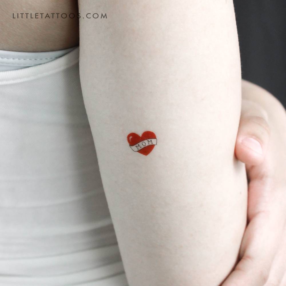 Small heart with "mom" banner temporary tattoo.