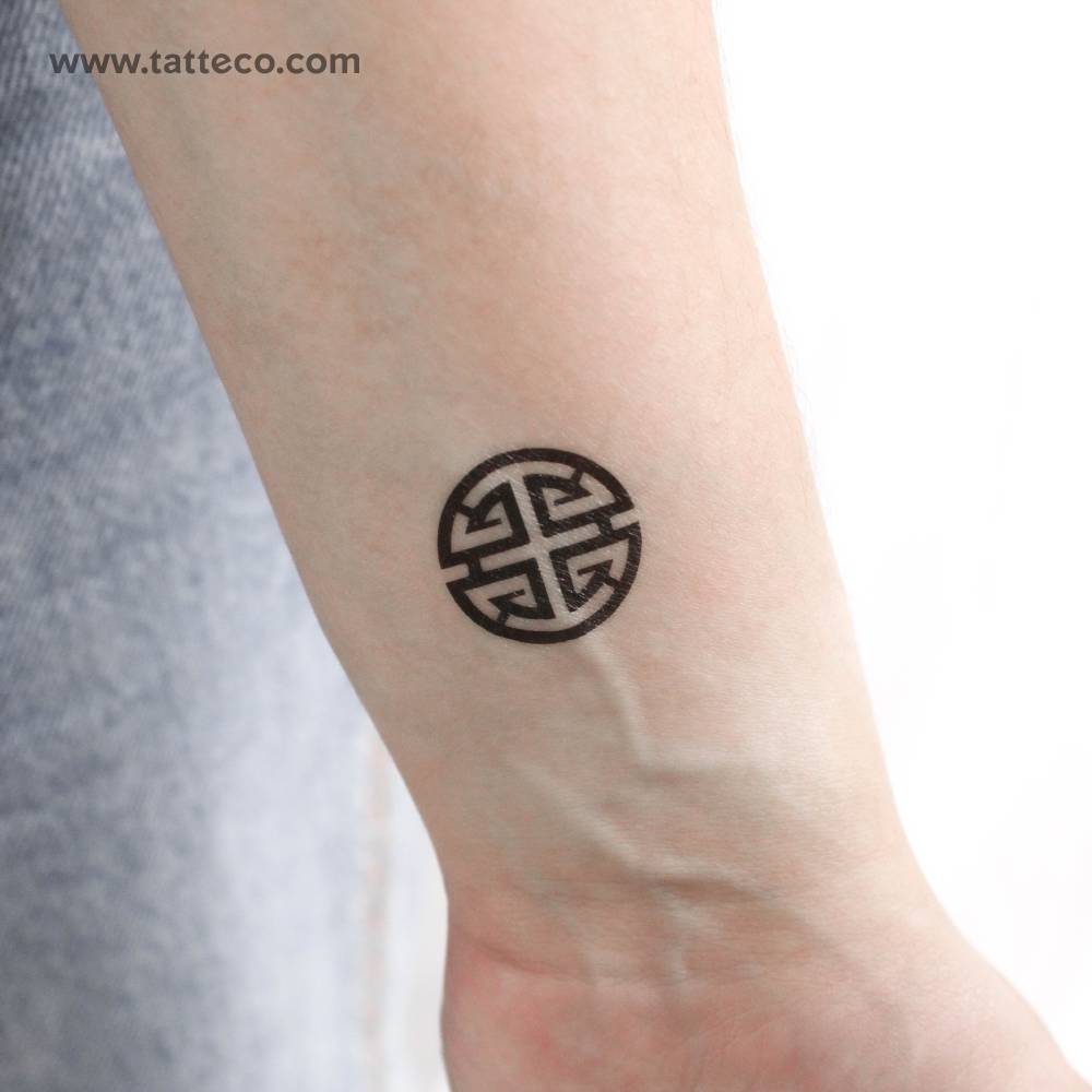 Fu symbol temporary tattoo located on the wrist.