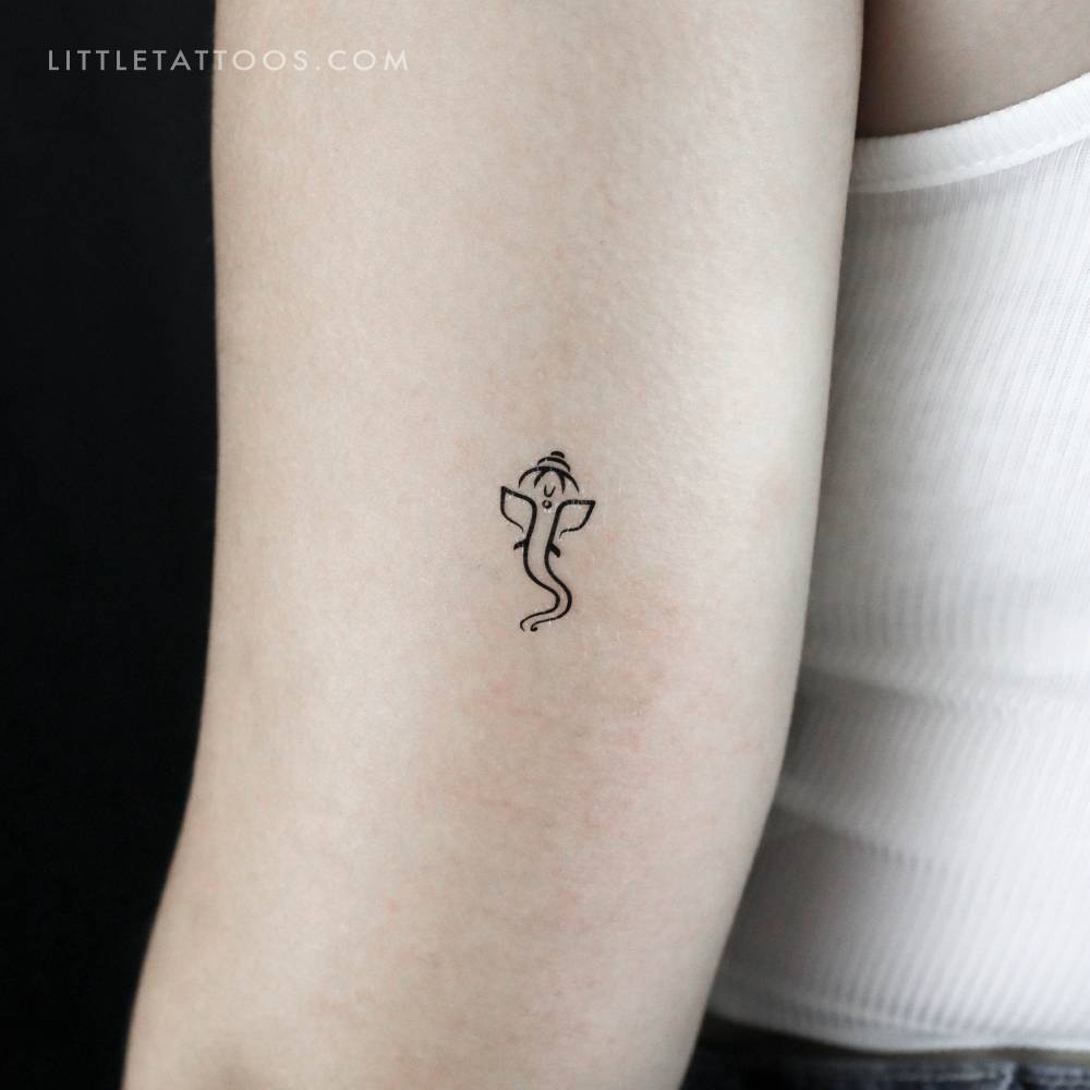 Minimalistic style Ganesha temporary tattoo placed on the tricep.
