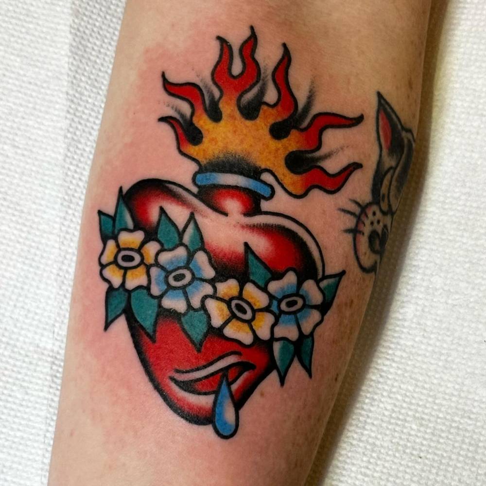 Traditional style Immaculate Heart of Mary tattoo located on the inner forearm.