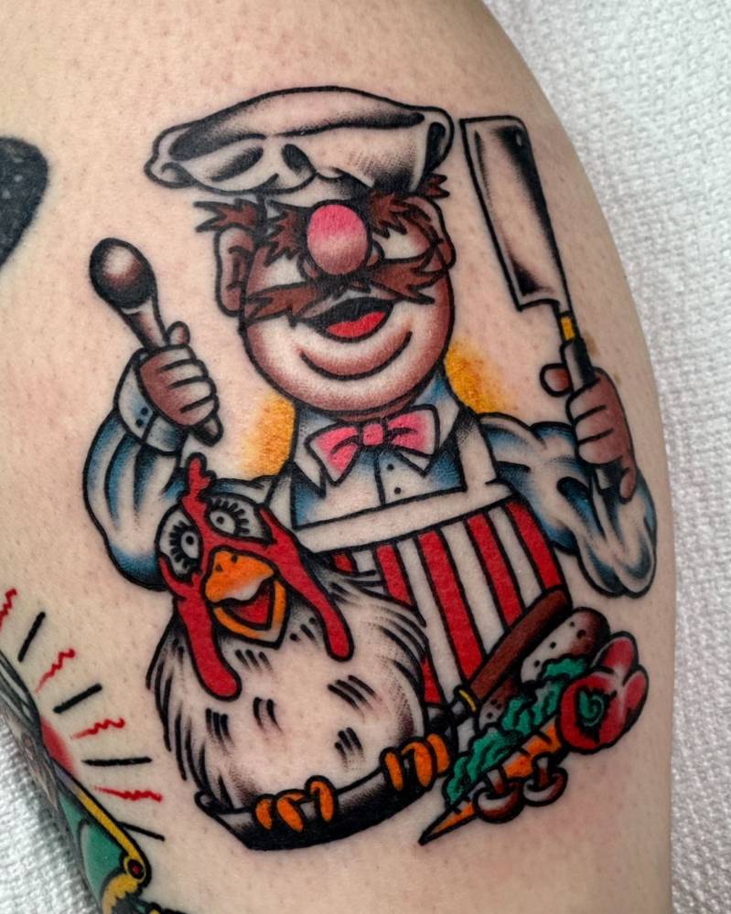 Traditional style Swedish Chef tattoo located on the calf.