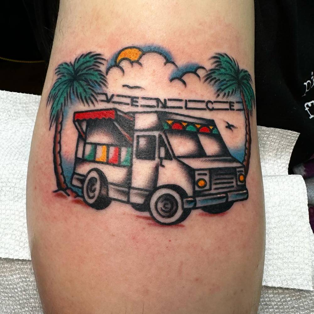RV tattoo located on the calf, done in traditional style.
