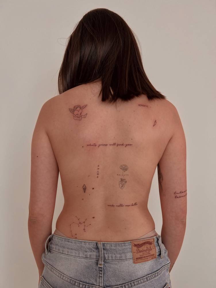Fine line style back composition tattoos.