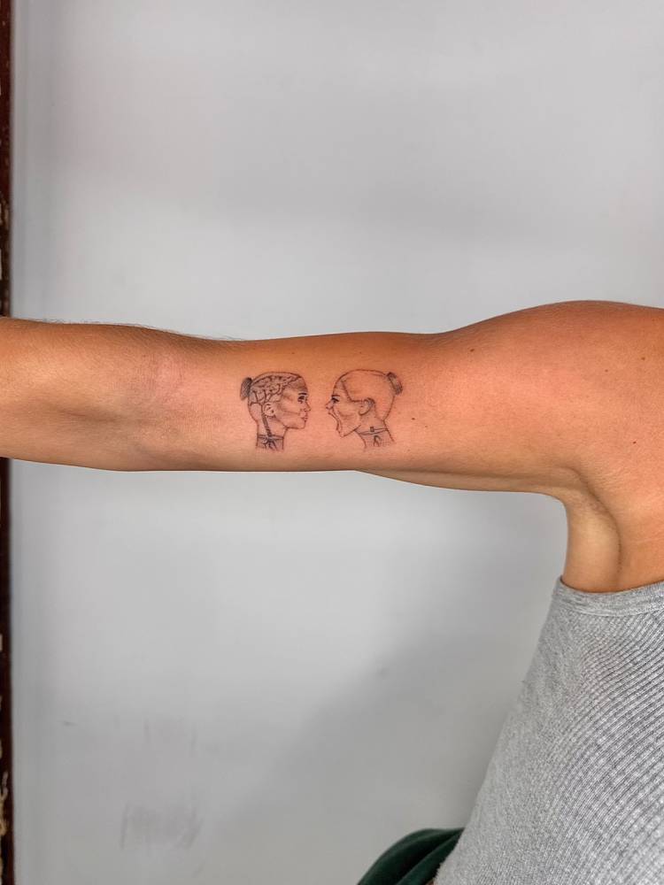 Single needle feelings and emotions tattoo located on the bicep.