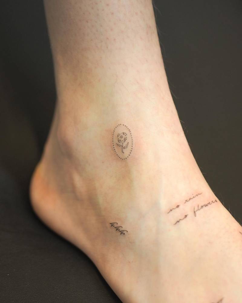 Fine line style foot composition tattoos.