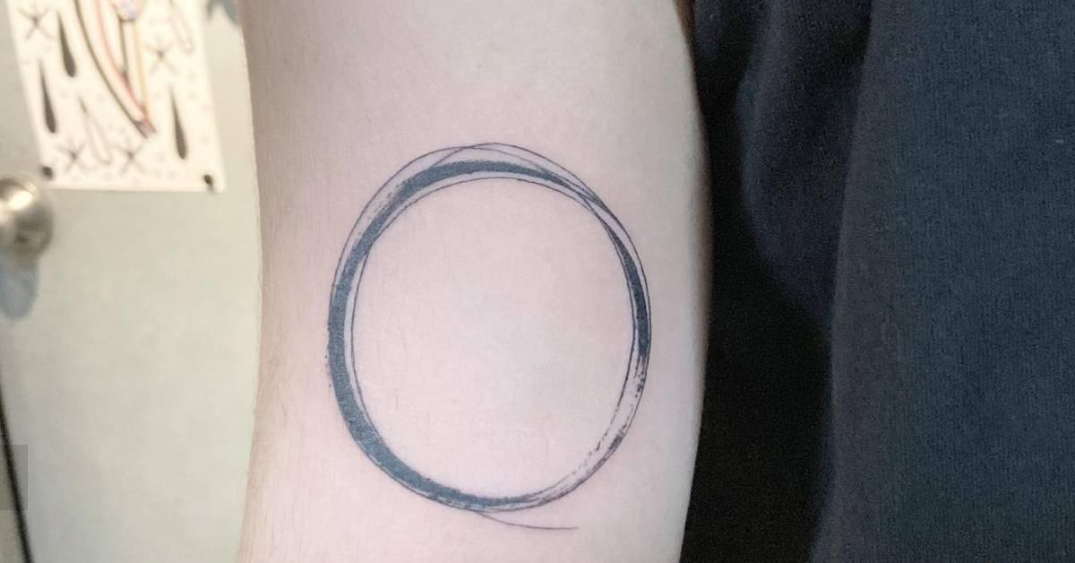 Sketch work style circle tattoo located on the inner