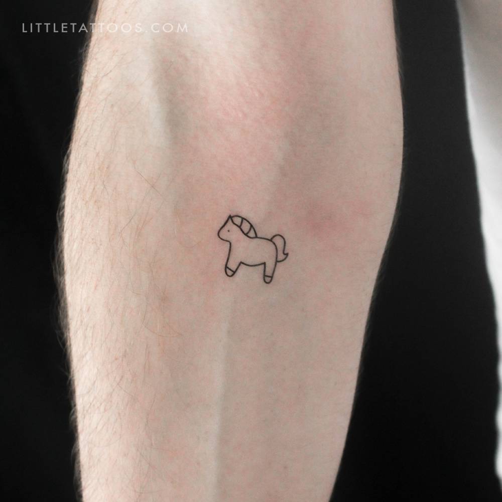 Minimalist little horse temporary tattoo done on the inner forearm.