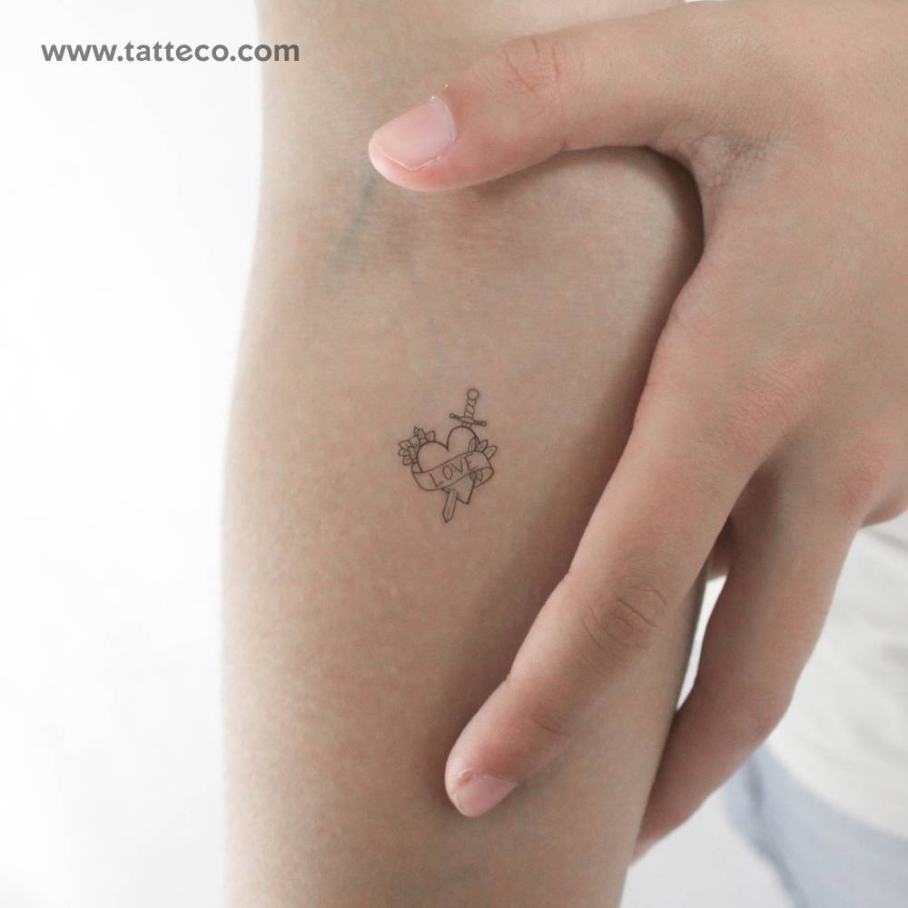 Heart and sword temporary tattoo in fine line style.