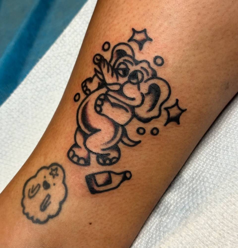 Drunk elephant tattoo in traditional style located on the ankle.