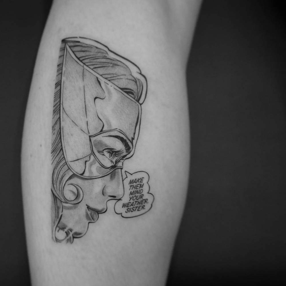 Jean Grey portrait tattoo in comic style placed on the calf.