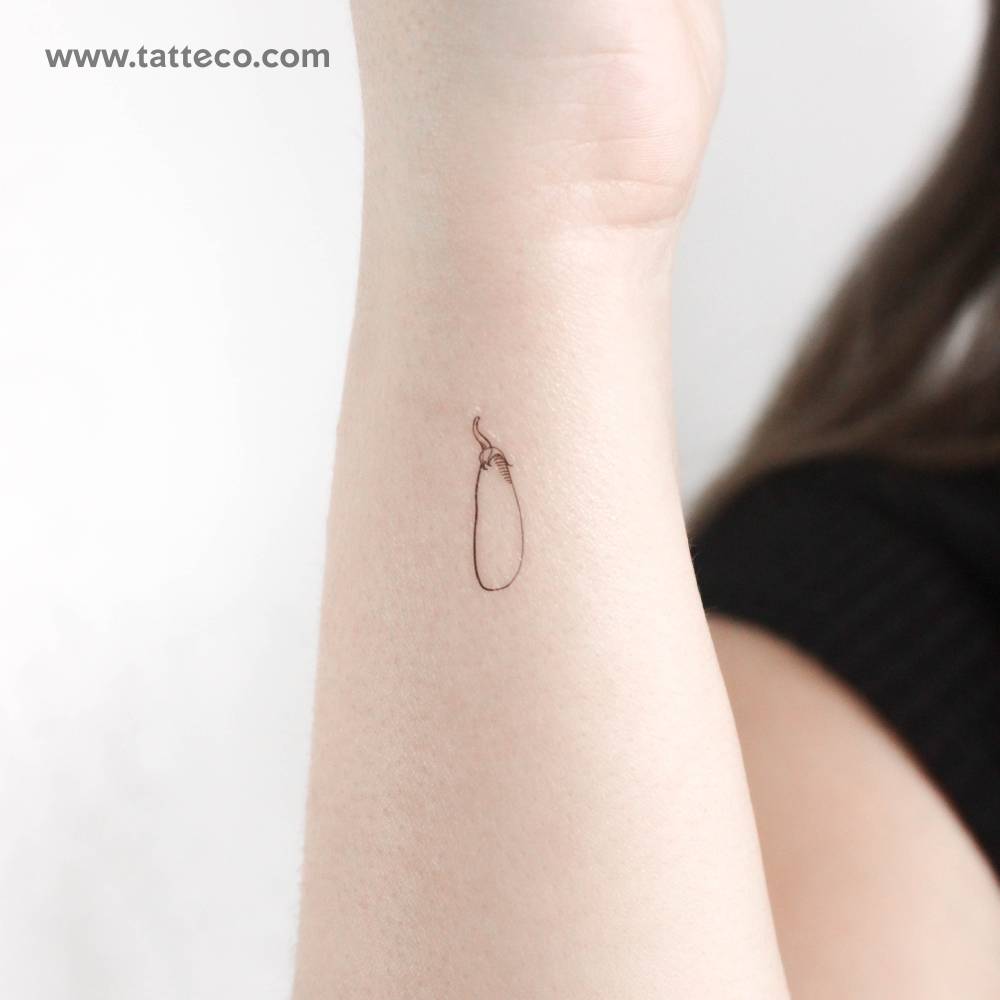 Eggplant temporary tattoo in fine line style.