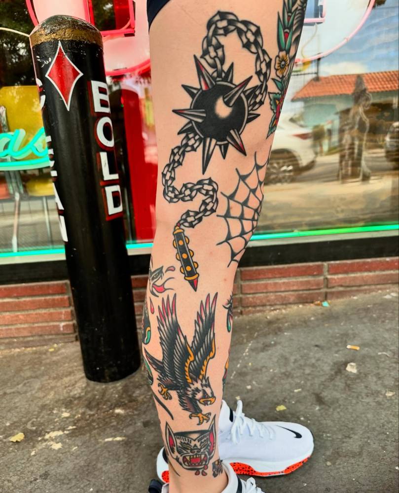 Flail tattoo in traditional style located on the leg.