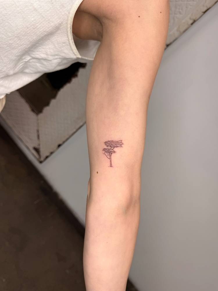 Maple tree tattoo located on the inner arm, done in fine line style.