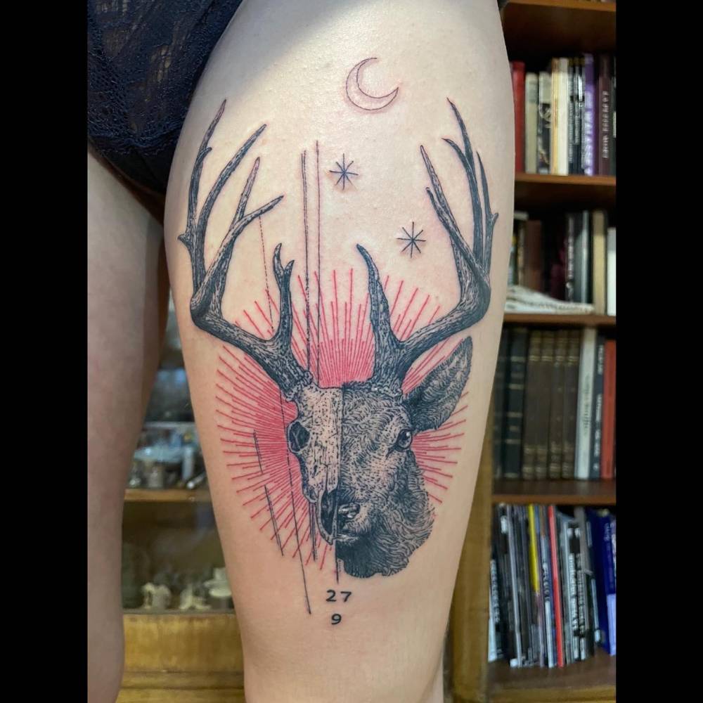 Deer portrait tattoo in graphic style located on the thigh.
