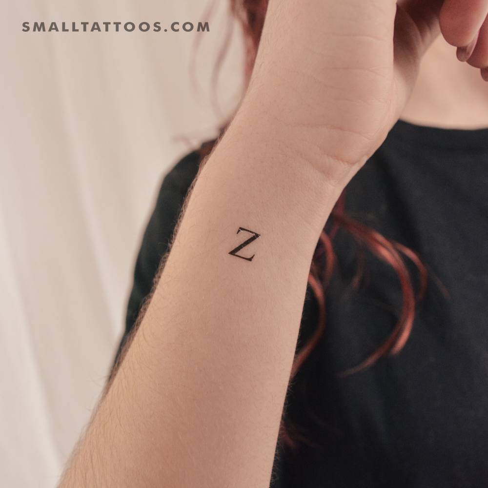 "Z" uppercase serif letter temporary tattoo located on the wrist.
