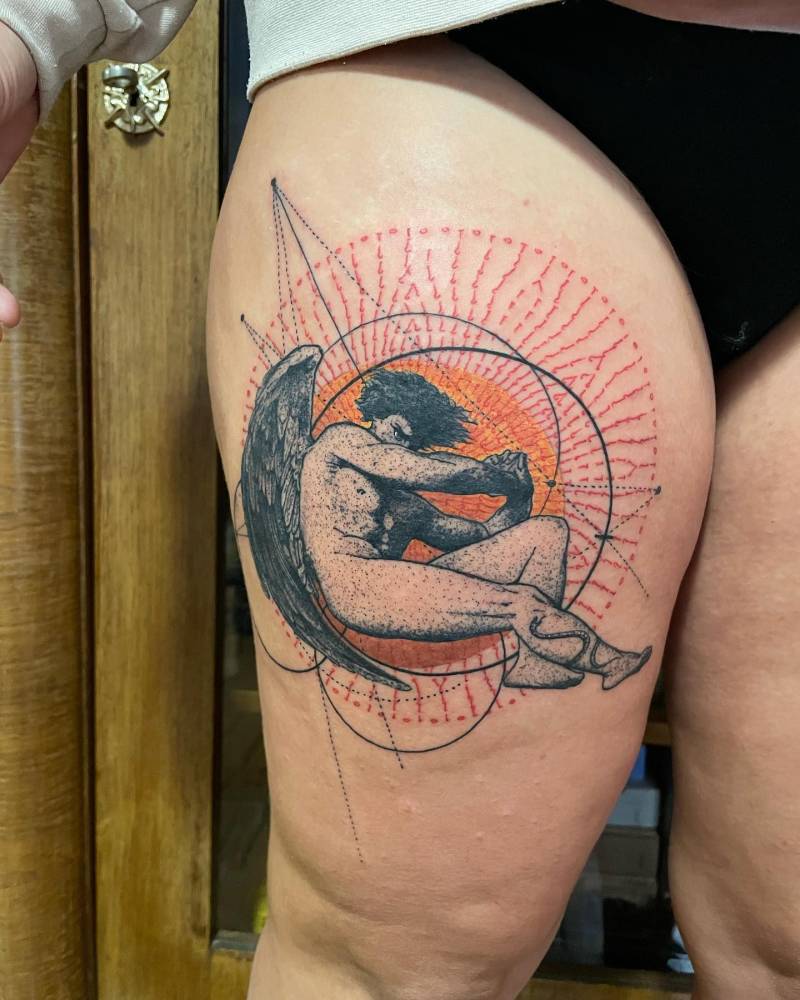 'Fallen Angel' tattoo in graphic style located on the thigh.