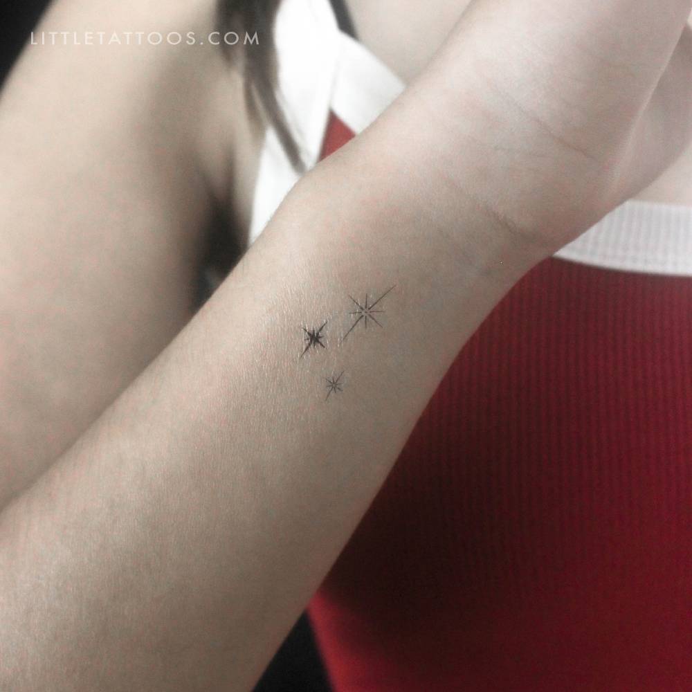Three sparkles temporary tattoo placed on the wrist.