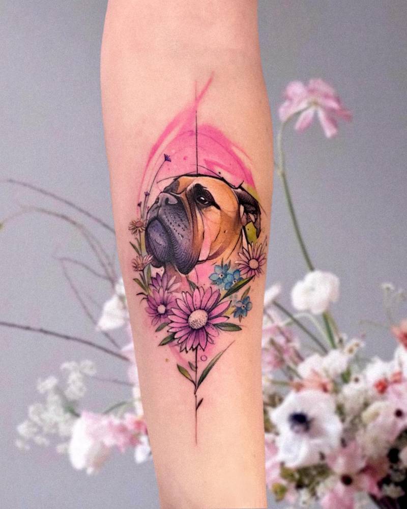 Watercolor style Boxer portrait tattoo located on the inner froearm.