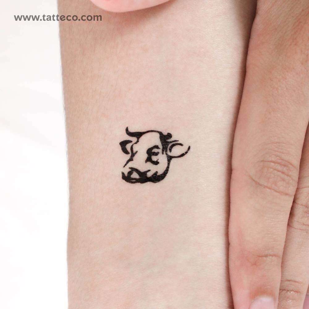 Cow head temporary tattoo located on the wrist.