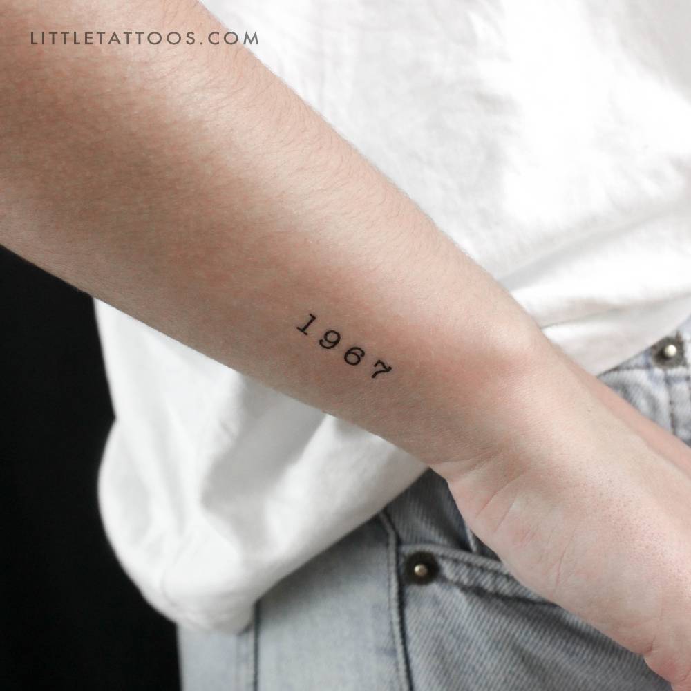 "1967" birth year temporary tattoo located on the wrist.