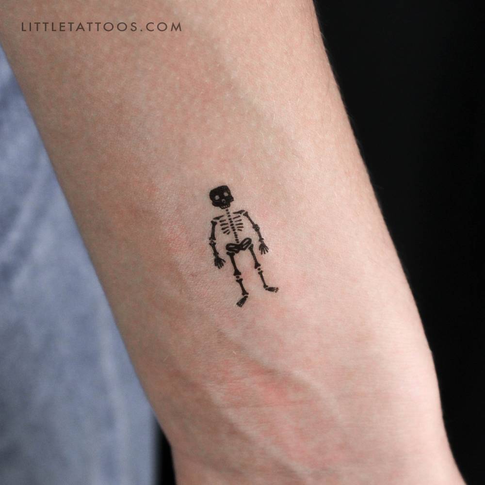 Little skeleton temporary tattoo placed on the wrist.