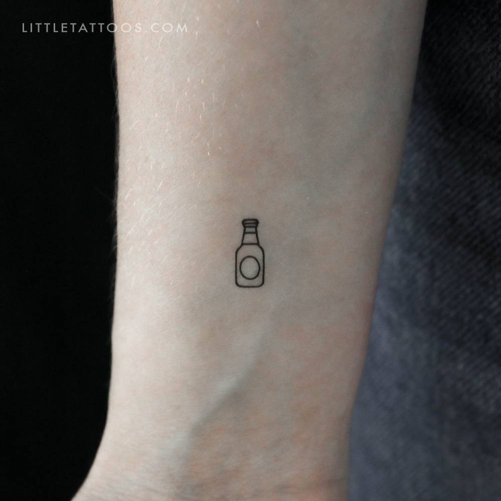 Minimalistic style tiny beer bottle temporary tattoo located on the wrist.