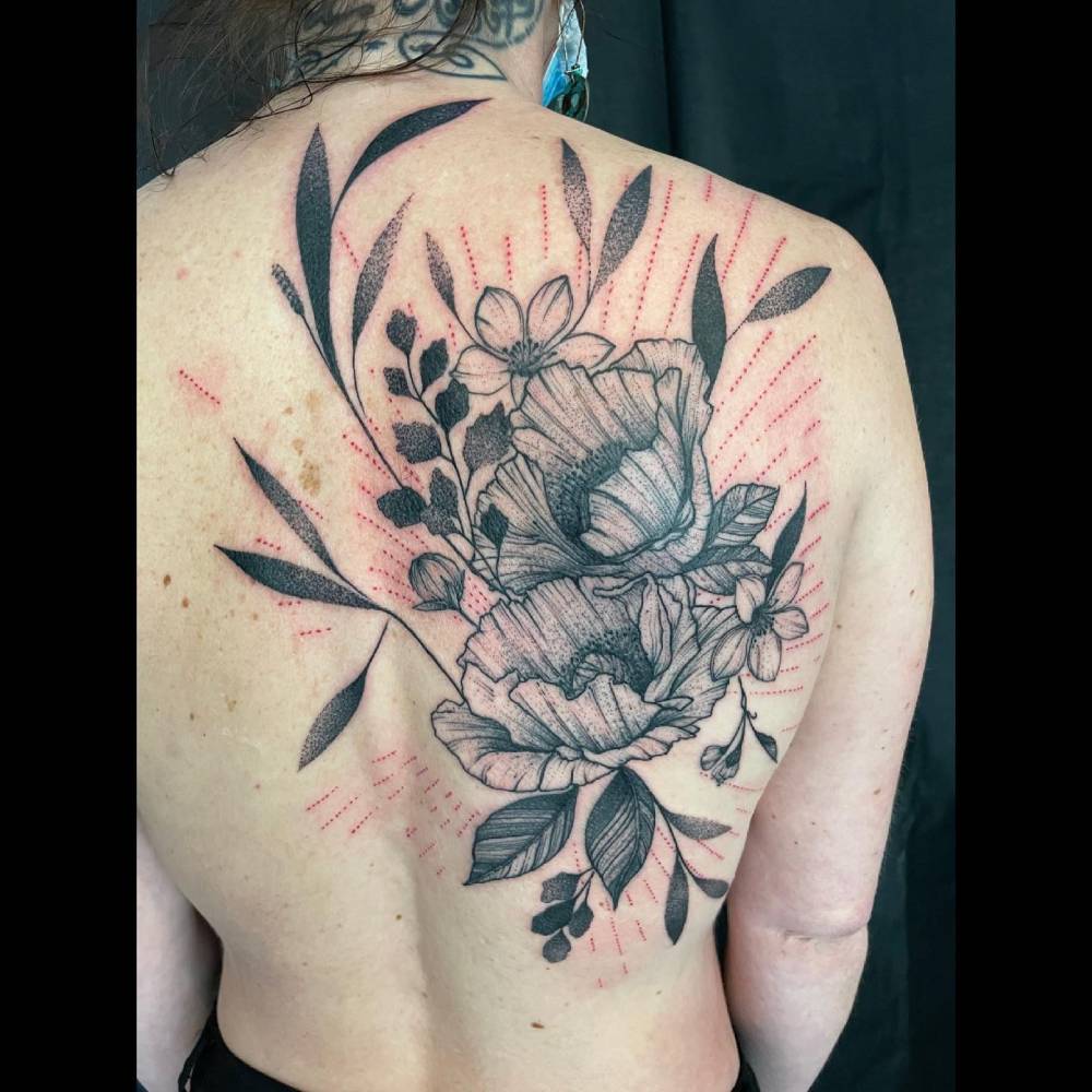 Flower bouquet tattoo in illustrative style located on the back.