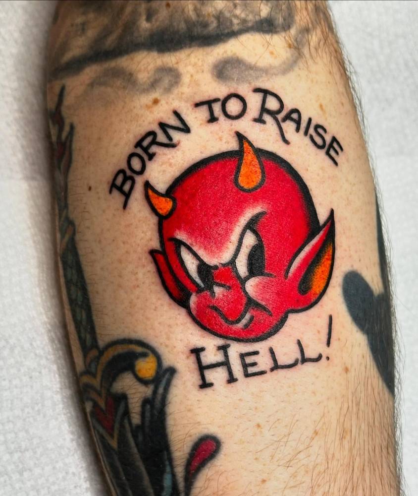 Hot Stuff portrait tattoo located on the inner forearm, cartoon style.