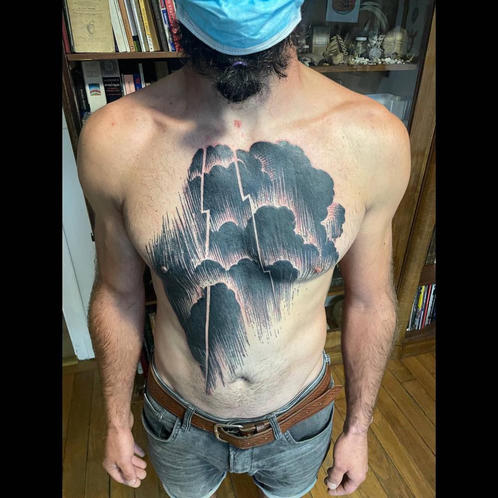 Rain tattoo in blackwork style located on the torso.