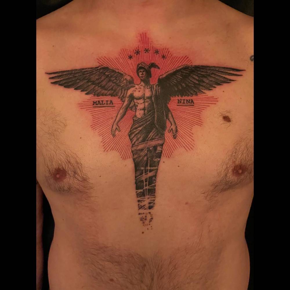 Graphic style angel tattoo located on the chest.