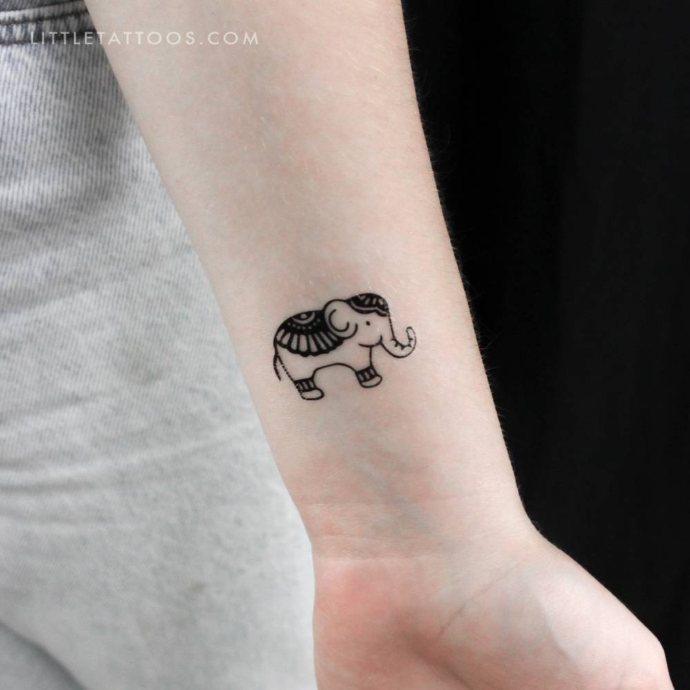 Ornamental elephant temporary tattoo located on the wrist.
