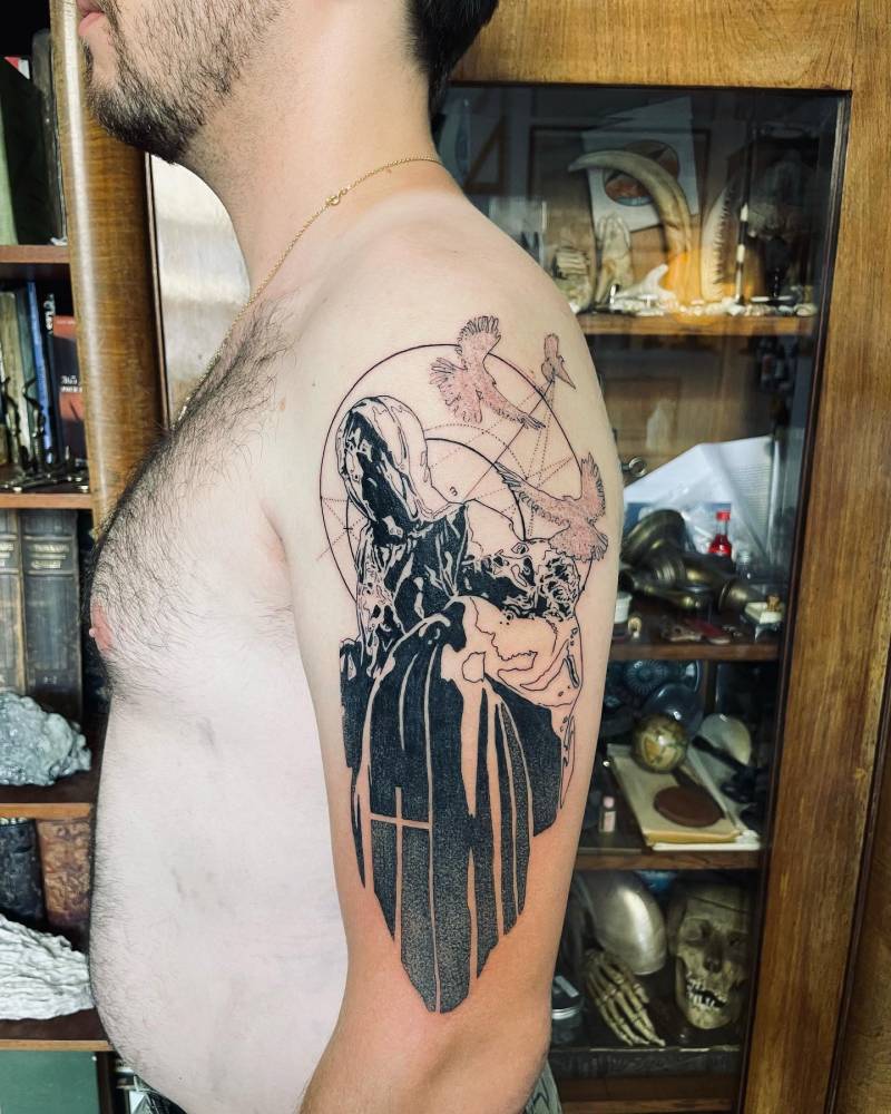 Graphic style Pieta tattoo located on the upper arm.