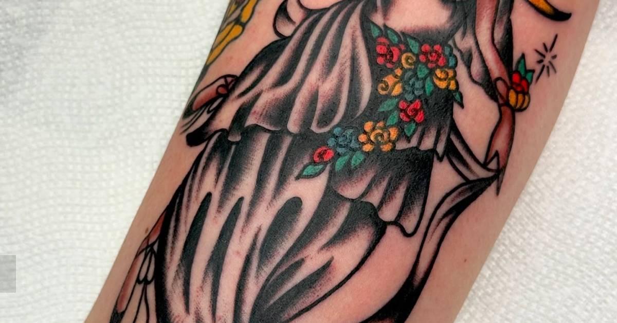 Woman tattoo in traditional style located on the inner