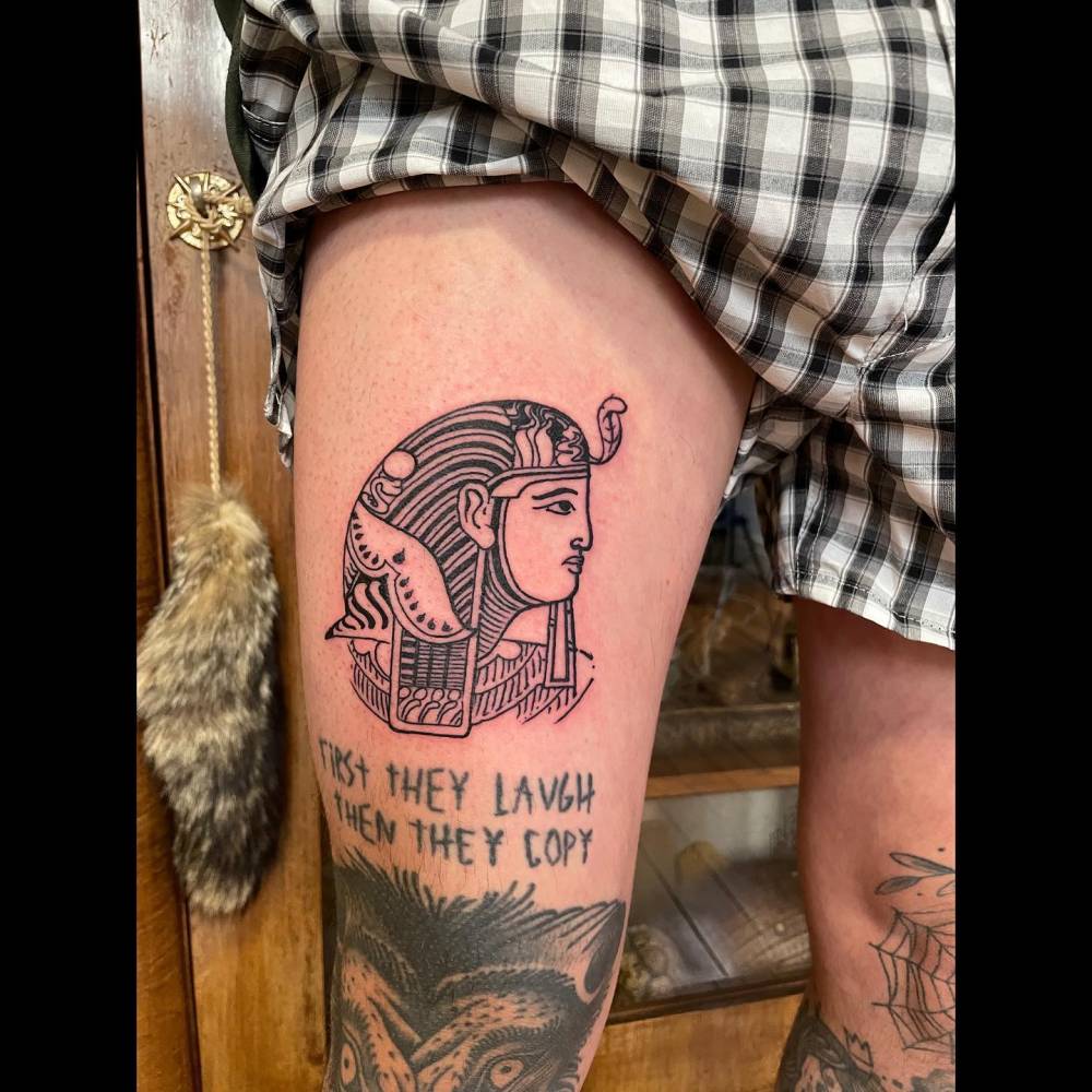 Illustrative style pharaoh tattoo placed on the thigh.