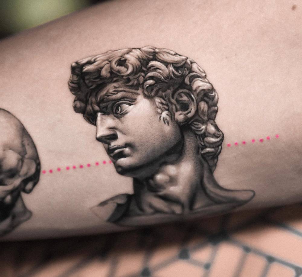 Michelangelo's David tattoo located on the forearm.
