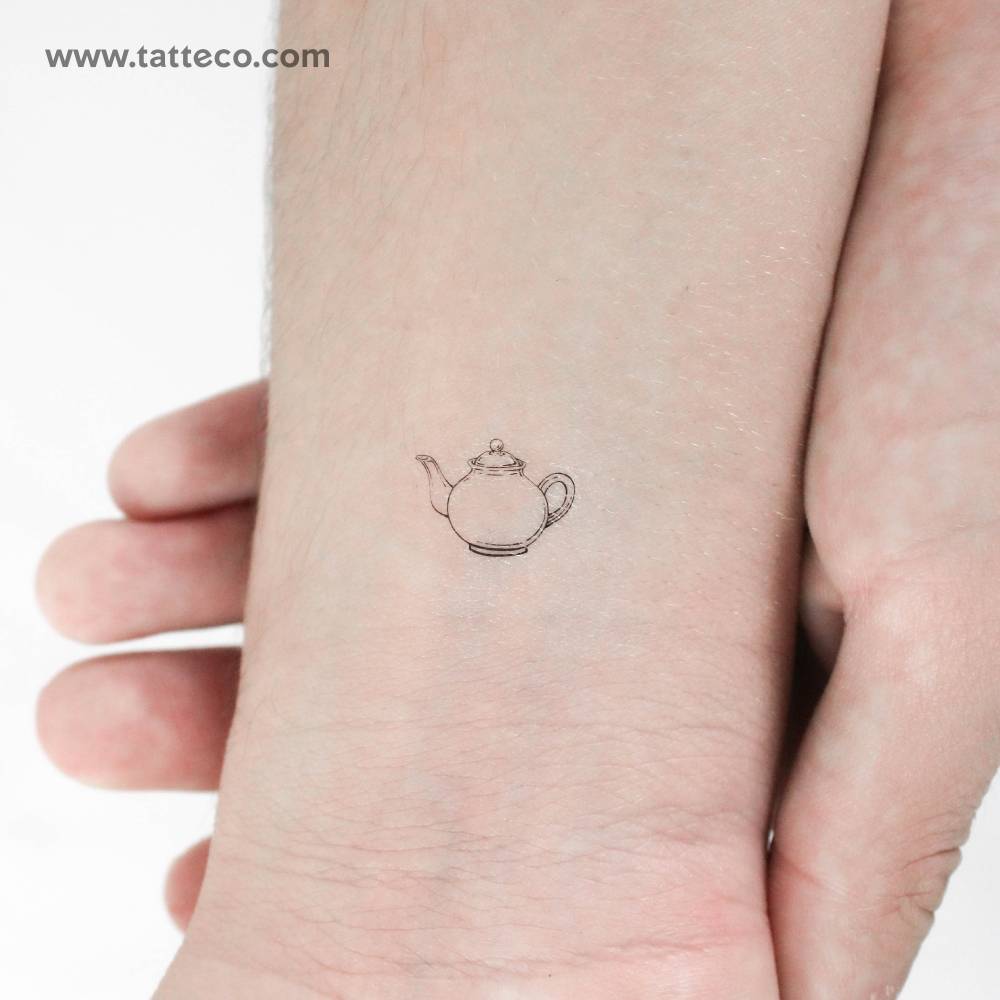 Teapot temporary tattoo in fine line style located on the wrist.
