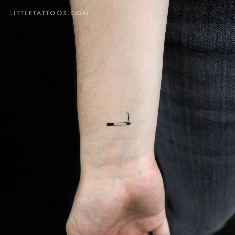 Minimalistic style cigarette temporary tattoo located on the wrist.