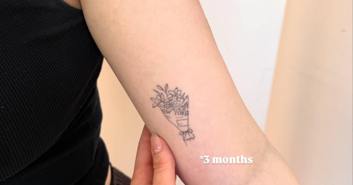 Flower bouquet tattoo in fine line style located on the