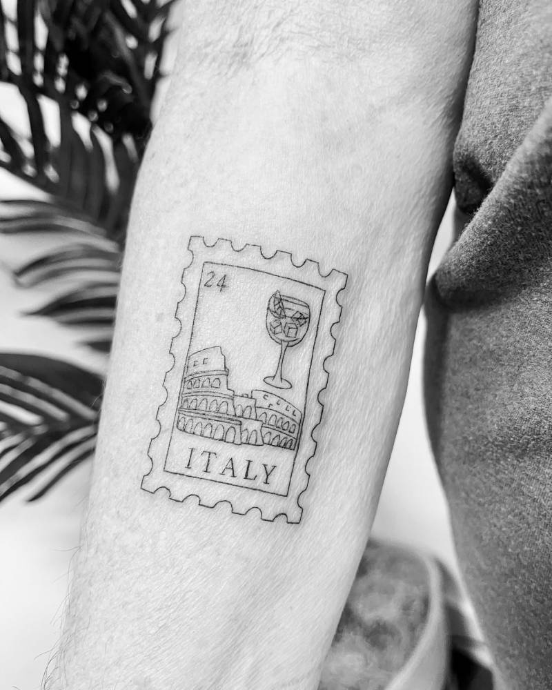 Italy stamp tattoo in fine line style located on the inner forearm.
