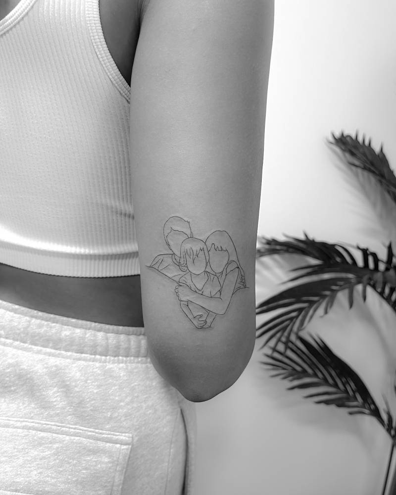 Family portrait tattoo in fine line style located on the tricep.