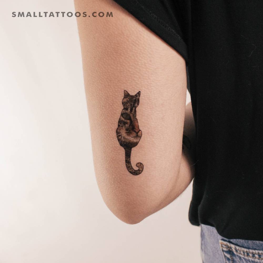 Cat silhouette temporary tattoo located on the tricep.