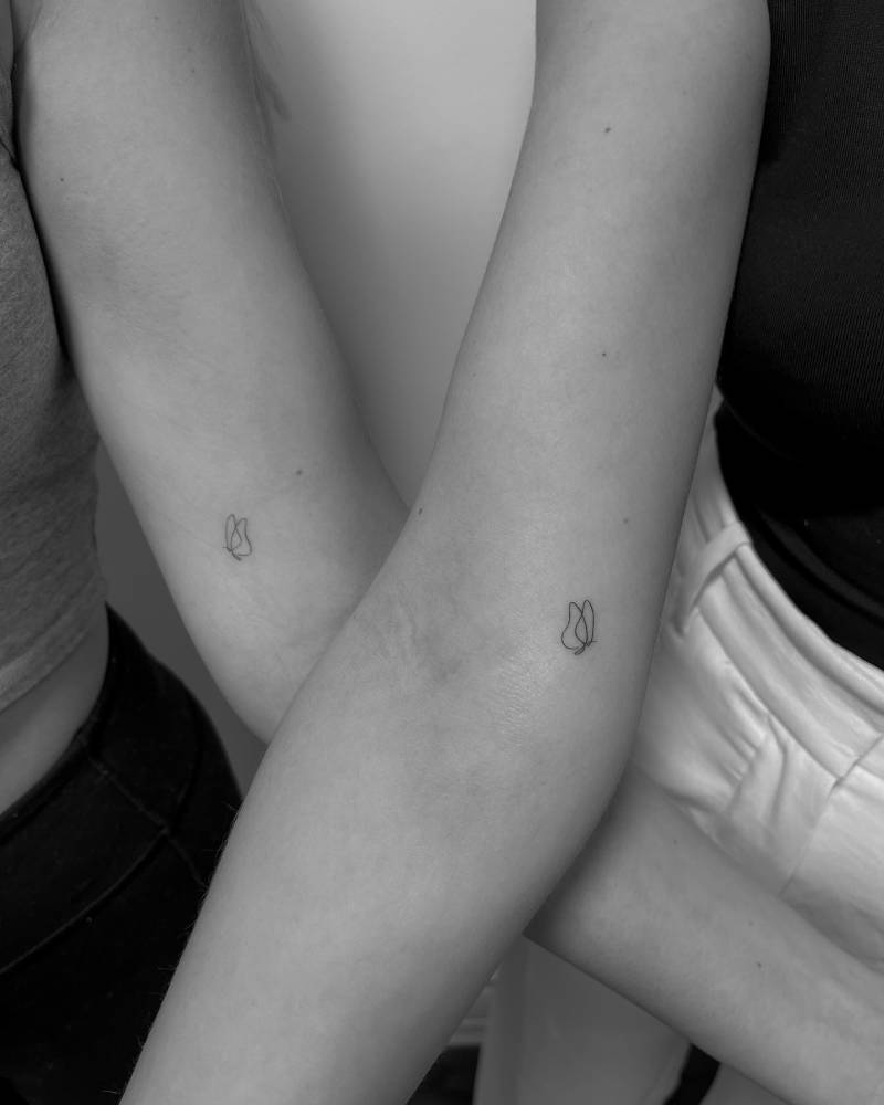 Tiny matching butterflies tattoo for best friends.