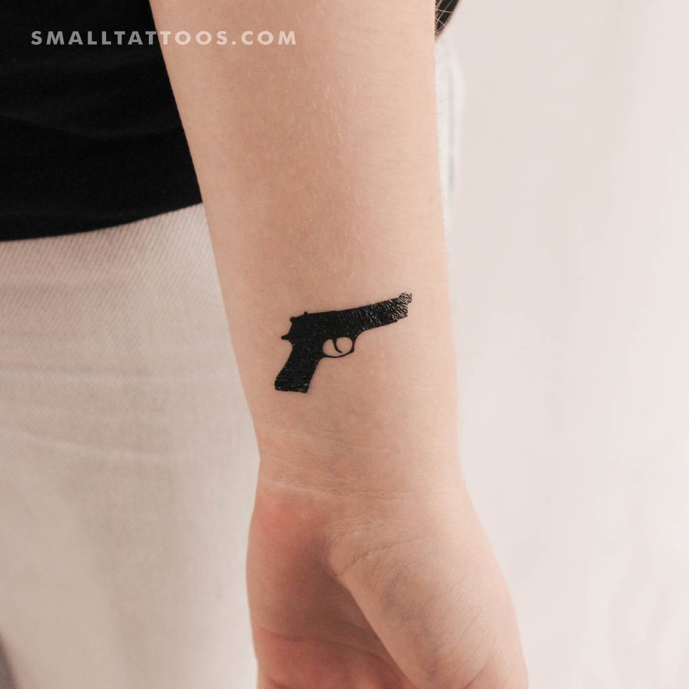 Minimalistic style Rihanna gun temporary tattoo.