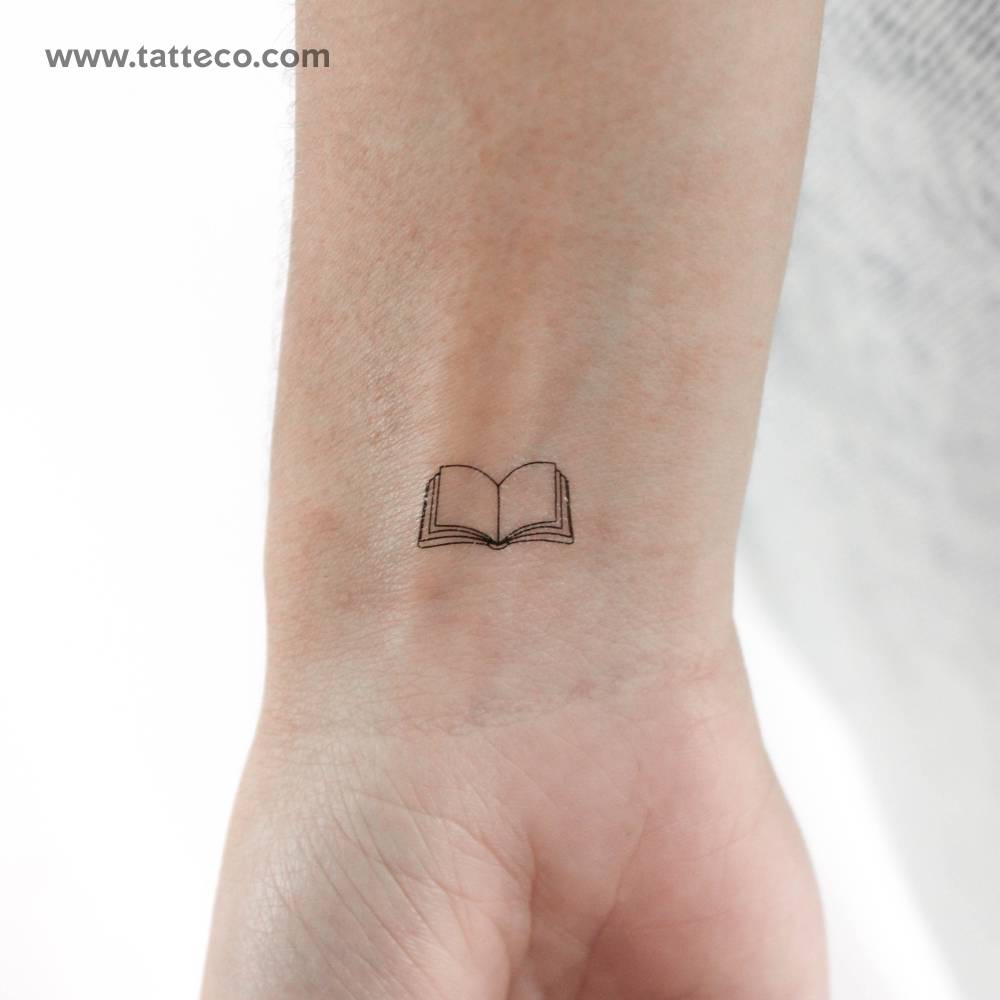 Fine line style little open book temporary tattoo.