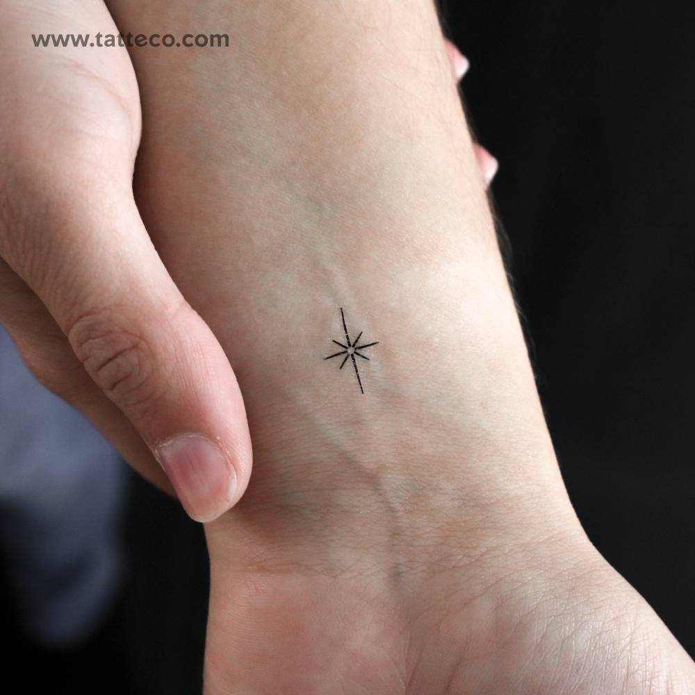 Tiny minimalistic north star temporary tattoo located on the wrist.