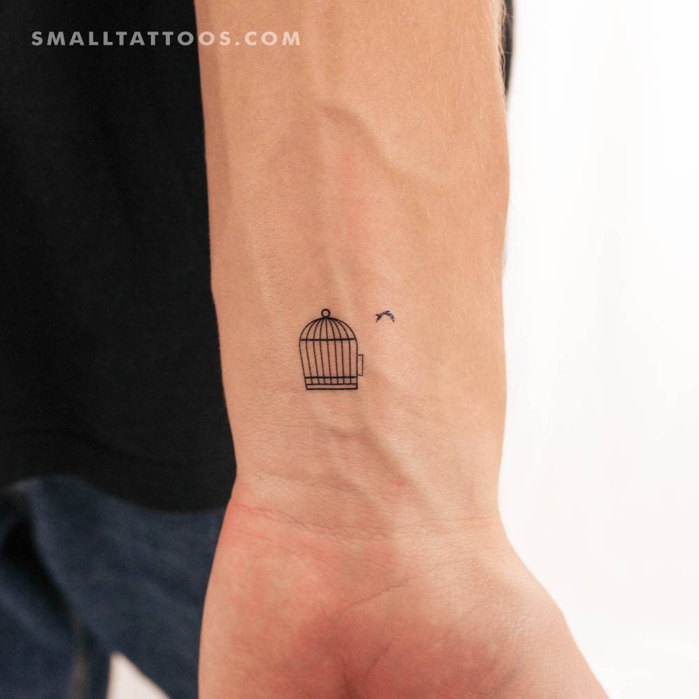 Minimalistic bird cage temporary tattoo located on the wrist.