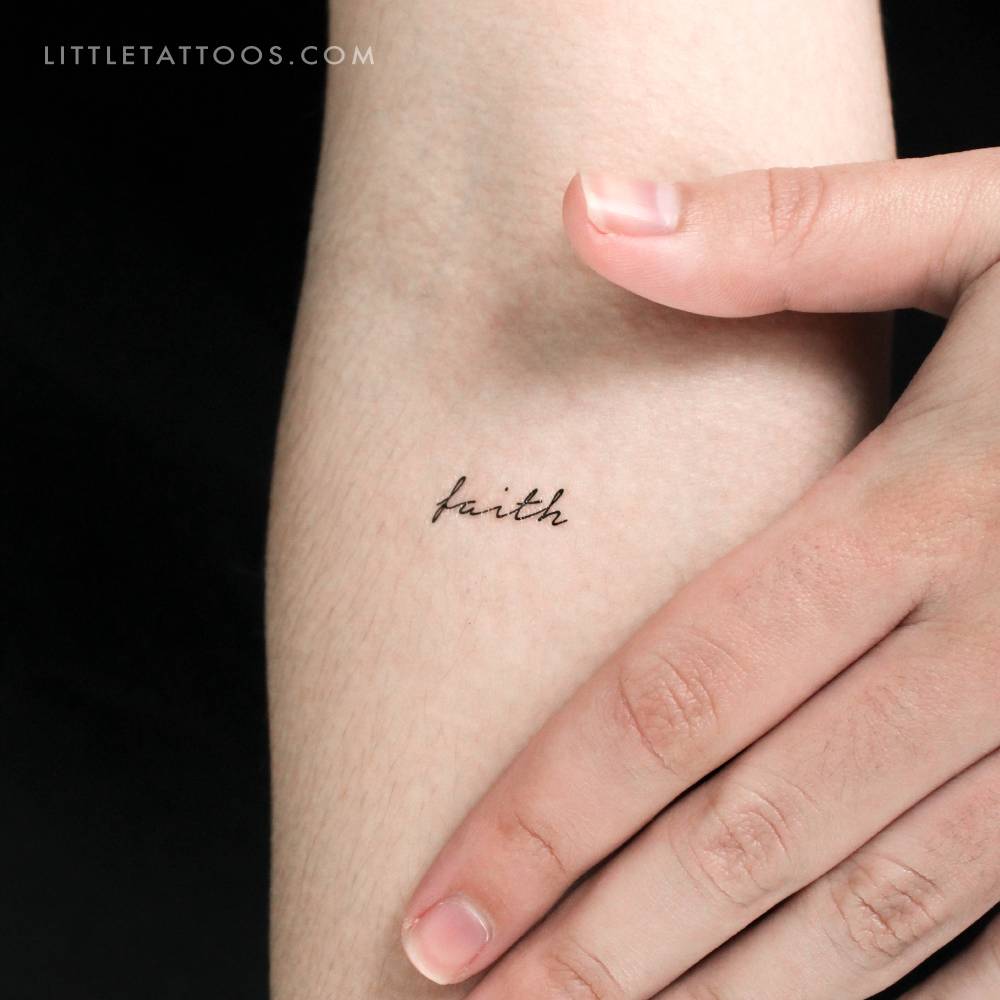 Handwritten font word 'faith' temporary tattoo located on the inner forearm.