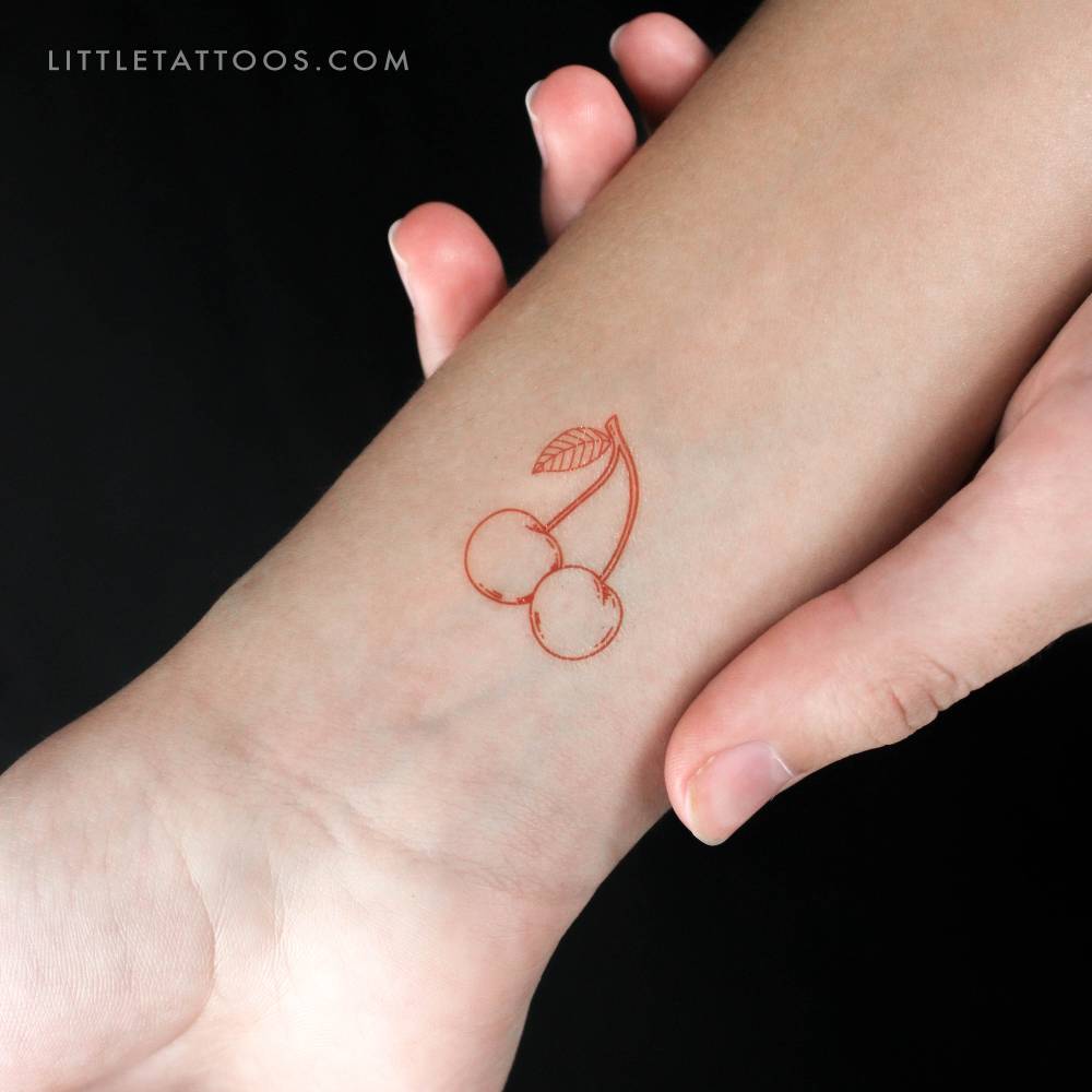 Red cherry couple temporary tattoo located on the wrist.
