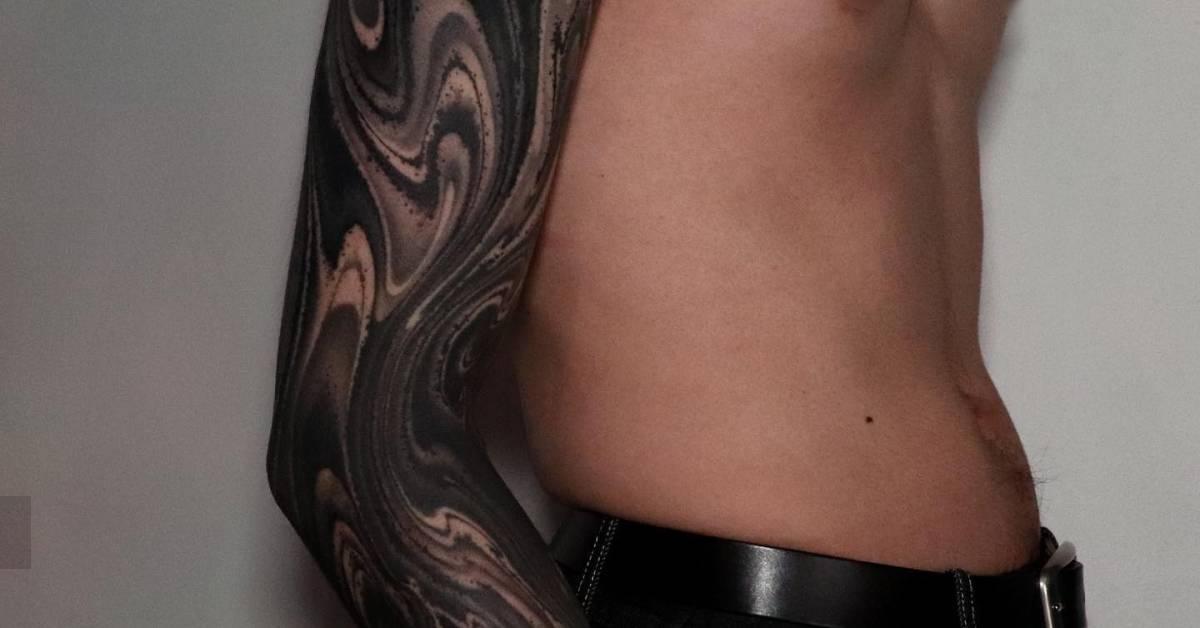 Abstract tattoo sleeve done in blackwork style.